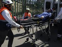 Members of Civil Protection are rescuing a person who suffered a fall while climbing Cerro de la Estrella in the Iztapalapa mayor's office i...