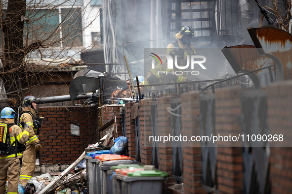 Firefighters are extinguishing a fire that has broken out at the commercial complex of Yeouido Gongjak Apartments in Seoul, South Korea, on...