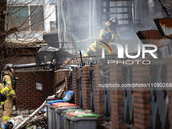 Firefighters are extinguishing a fire that has broken out at the commercial complex of Yeouido Gongjak Apartments in Seoul, South Korea, on...