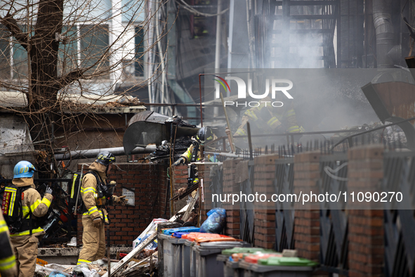 Firefighters are extinguishing a fire that has broken out at the commercial complex of Yeouido Gongjak Apartments in Seoul, South Korea, on...