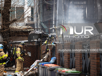 Firefighters are extinguishing a fire that has broken out at the commercial complex of Yeouido Gongjak Apartments in Seoul, South Korea, on...