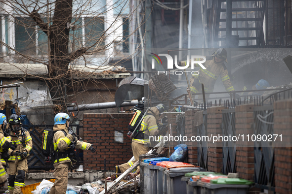 Firefighters are extinguishing a fire that has broken out at the commercial complex of Yeouido Gongjak Apartments in Seoul, South Korea, on...