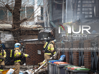 Firefighters are extinguishing a fire that has broken out at the commercial complex of Yeouido Gongjak Apartments in Seoul, South Korea, on...