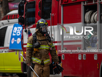 Firefighters are extinguishing a fire that has broken out at the commercial complex of Yeouido Gongjak Apartments in Seoul, South Korea, on...