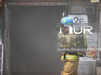 Firefighters are extinguishing a fire that has broken out at the commercial complex of Yeouido Gongjak Apartments in Seoul, South Korea, on...