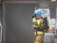 Firefighters are extinguishing a fire that has broken out at the commercial complex of Yeouido Gongjak Apartments in Seoul, South Korea, on...