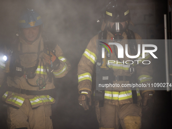 Firefighters are extinguishing a fire that has broken out at the commercial complex of Yeouido Gongjak Apartments in Seoul, South Korea, on...