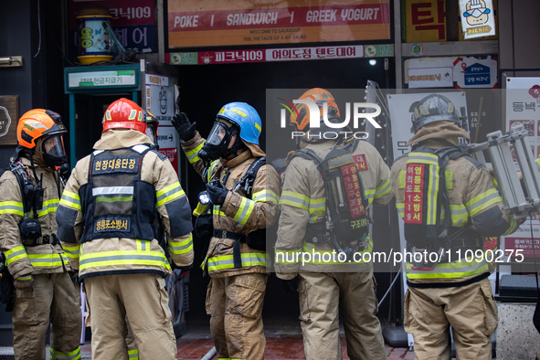 Firefighters are extinguishing a fire that has broken out at the commercial complex of Yeouido Gongjak Apartments in Seoul, South Korea, on...