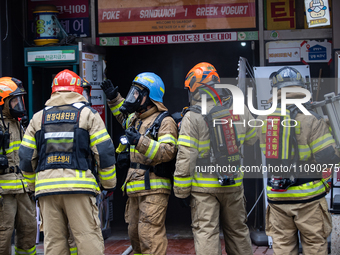 Firefighters are extinguishing a fire that has broken out at the commercial complex of Yeouido Gongjak Apartments in Seoul, South Korea, on...