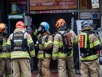 Firefighters are extinguishing a fire that has broken out at the commercial complex of Yeouido Gongjak Apartments in Seoul, South Korea, on...