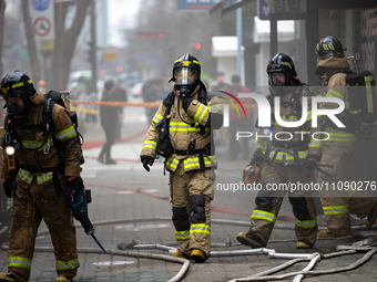 Firefighters are extinguishing a fire that has broken out at the commercial complex of Yeouido Gongjak Apartments in Seoul, South Korea, on...