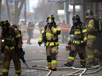 Firefighters are extinguishing a fire that has broken out at the commercial complex of Yeouido Gongjak Apartments in Seoul, South Korea, on...