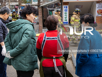 Firefighters are extinguishing a fire that has broken out at the commercial complex of Yeouido Gongjak Apartments in Seoul, South Korea, on...