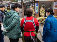 Firefighters are extinguishing a fire that has broken out at the commercial complex of Yeouido Gongjak Apartments in Seoul, South Korea, on...