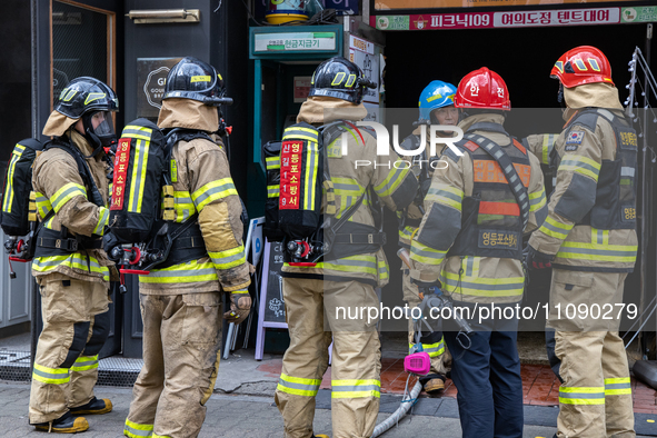 Firefighters are extinguishing a fire that has broken out at the commercial complex of Yeouido Gongjak Apartments in Seoul, South Korea, on...