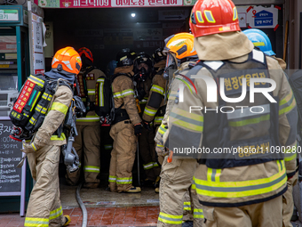 Firefighters are extinguishing a fire that has broken out at the commercial complex of Yeouido Gongjak Apartments in Seoul, South Korea, on...