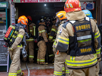 Firefighters are extinguishing a fire that has broken out at the commercial complex of Yeouido Gongjak Apartments in Seoul, South Korea, on...