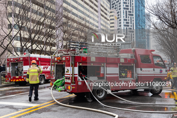 Firefighters are extinguishing a fire that has broken out at the commercial complex of Yeouido Gongjak Apartments in Seoul, South Korea, on...