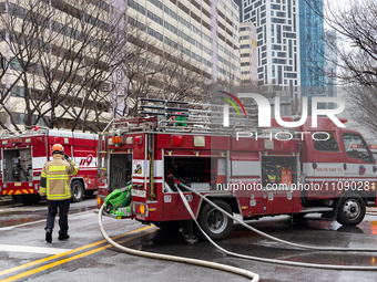 Firefighters are extinguishing a fire that has broken out at the commercial complex of Yeouido Gongjak Apartments in Seoul, South Korea, on...