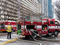 Firefighters are extinguishing a fire that has broken out at the commercial complex of Yeouido Gongjak Apartments in Seoul, South Korea, on...