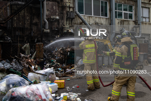 Firefighters are extinguishing a fire that has broken out at the commercial complex of Yeouido Gongjak Apartments in Seoul, South Korea, on...