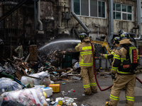 Firefighters are extinguishing a fire that has broken out at the commercial complex of Yeouido Gongjak Apartments in Seoul, South Korea, on...