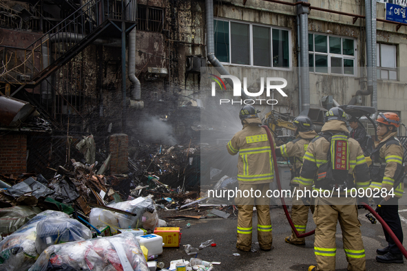 Firefighters are extinguishing a fire that has broken out at the commercial complex of Yeouido Gongjak Apartments in Seoul, South Korea, on...