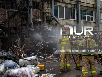 Firefighters are extinguishing a fire that has broken out at the commercial complex of Yeouido Gongjak Apartments in Seoul, South Korea, on...