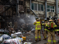 Firefighters are extinguishing a fire that has broken out at the commercial complex of Yeouido Gongjak Apartments in Seoul, South Korea, on...