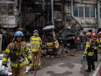 Firefighters are extinguishing a fire that has broken out at the commercial complex of Yeouido Gongjak Apartments in Seoul, South Korea, on...