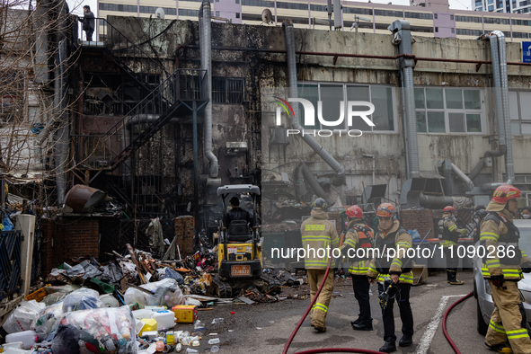 Firefighters are extinguishing a fire that has broken out at the commercial complex of Yeouido Gongjak Apartments in Seoul, South Korea, on...