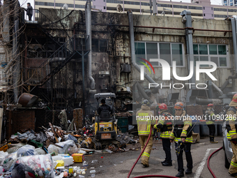 Firefighters are extinguishing a fire that has broken out at the commercial complex of Yeouido Gongjak Apartments in Seoul, South Korea, on...