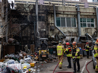 Firefighters are extinguishing a fire that has broken out at the commercial complex of Yeouido Gongjak Apartments in Seoul, South Korea, on...