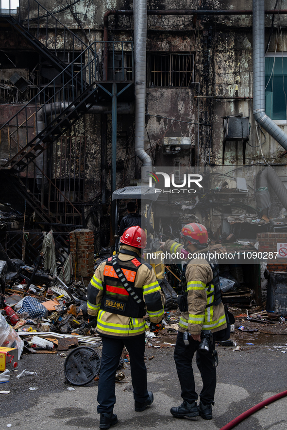 Firefighters are extinguishing a fire that has broken out at the commercial complex of Yeouido Gongjak Apartments in Seoul, South Korea, on...