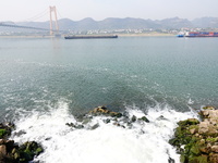 Purified water from the sewage treatment plant is meeting the standards and is being discharged into the Yangtze River in Yichang, Hubei, Ch...