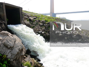 Purified water from the sewage treatment plant is meeting the standards and is being discharged into the Yangtze River in Yichang, Hubei, Ch...