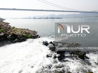 Purified water from the sewage treatment plant is meeting the standards and is being discharged into the Yangtze River in Yichang, Hubei, Ch...