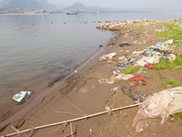 Debris is floating downstream, brought by the 2023 Yangtze River flood, near the Linjiangxi Bridge in Yichang on the Yangtze River in Yichan...