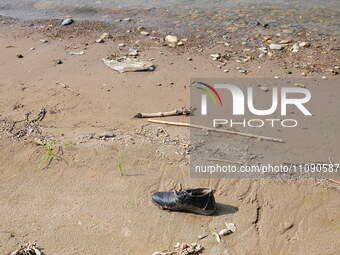 Debris is floating downstream, brought by the 2023 Yangtze River flood, near the Linjiangxi Bridge in Yichang on the Yangtze River in Yichan...