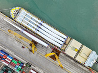 Border police are monitoring the hoisting of the world's longest 108-meter, 100-ton high-power wind turbine blades onto a cruise ship at Fuz...