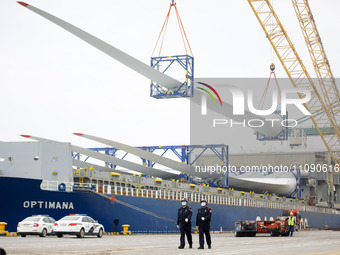 Border police are monitoring the hoisting of the world's longest 108-meter, 100-ton high-power wind turbine blades onto a cruise ship at Fuz...