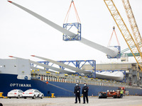 Border police are monitoring the hoisting of the world's longest 108-meter, 100-ton high-power wind turbine blades onto a cruise ship at Fuz...