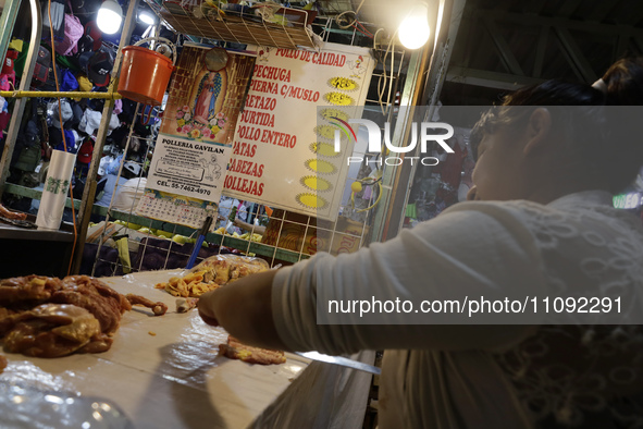 A woman is cutting chicken into pieces for sale at a market in Mexico City. Recently, the Ministry of Health of Tlaxcala in Mexico issued an...