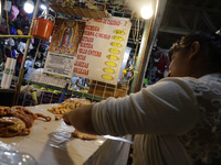 A woman is cutting chicken into pieces for sale at a market in Mexico City. Recently, the Ministry of Health of Tlaxcala in Mexico issued an...