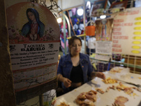 A woman is cutting chicken into pieces for sale at a market in Mexico City. Recently, the Ministry of Health of Tlaxcala in Mexico issued an...