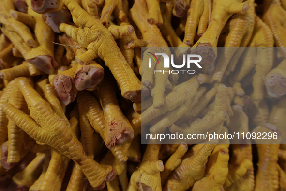 Chickens are for sale at a market in Mexico City. Recently, the Ministry of Health of Tlaxcala, Mexico, issued an epidemiological alert due...