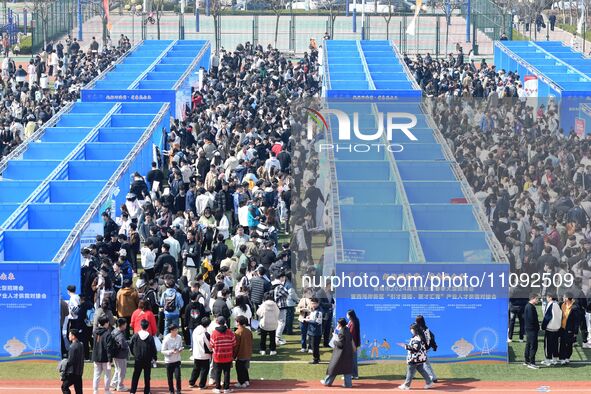 College graduates are attending a job fair in Qingdao, Shandong Province, China, on March 23, 2024. 