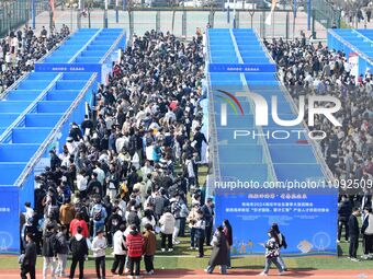 College graduates are attending a job fair in Qingdao, Shandong Province, China, on March 23, 2024. (