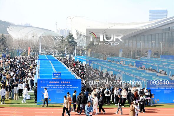 College graduates are attending a job fair in Qingdao, Shandong Province, China, on March 23, 2024. 