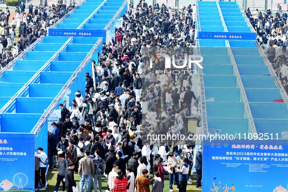 College graduates are attending a job fair in Qingdao, Shandong Province, China, on March 23, 2024. 